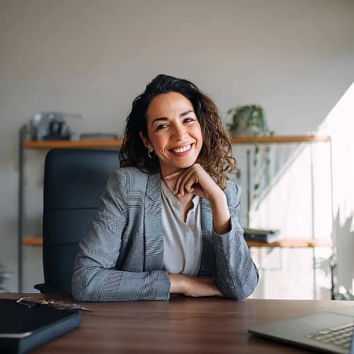 Independent transaction coordinator working confidently at her desk, symbolizing AI-powered real-estate workflow automation and stress-free contract management.